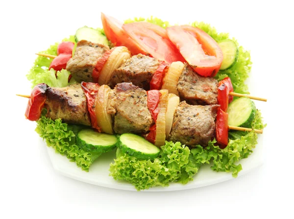 Tasty grilled meat and vegetables on skewers on plate, isolated on white — Stock Photo, Image