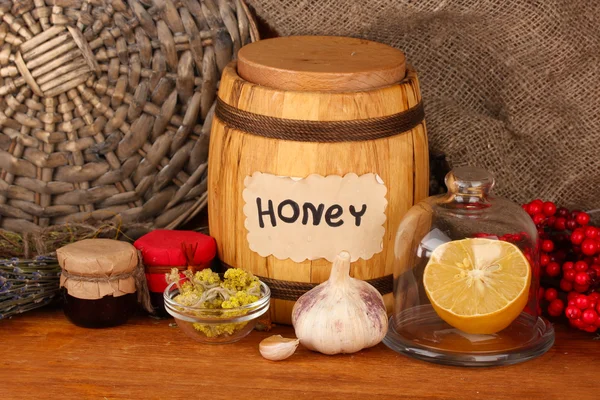 Honey and others natural medicine for winter flue, on wooden background — Stock Photo, Image