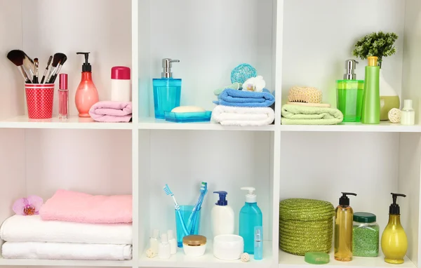 Bath accessories on shelfs in bathroom — Stock Photo, Image