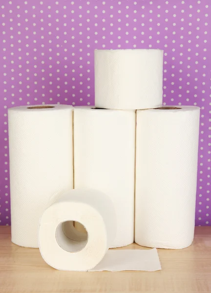 Rolls of toilet paper on purple with dots background — Stok fotoğraf