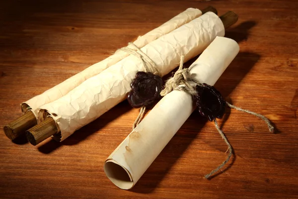 Old scrolls, on wooden background