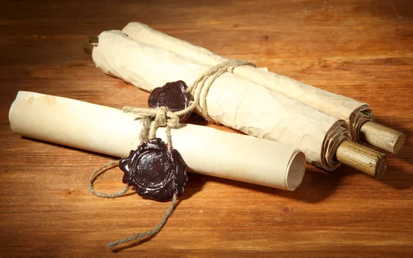 Old scrolls, on wooden background — Stock Photo, Image