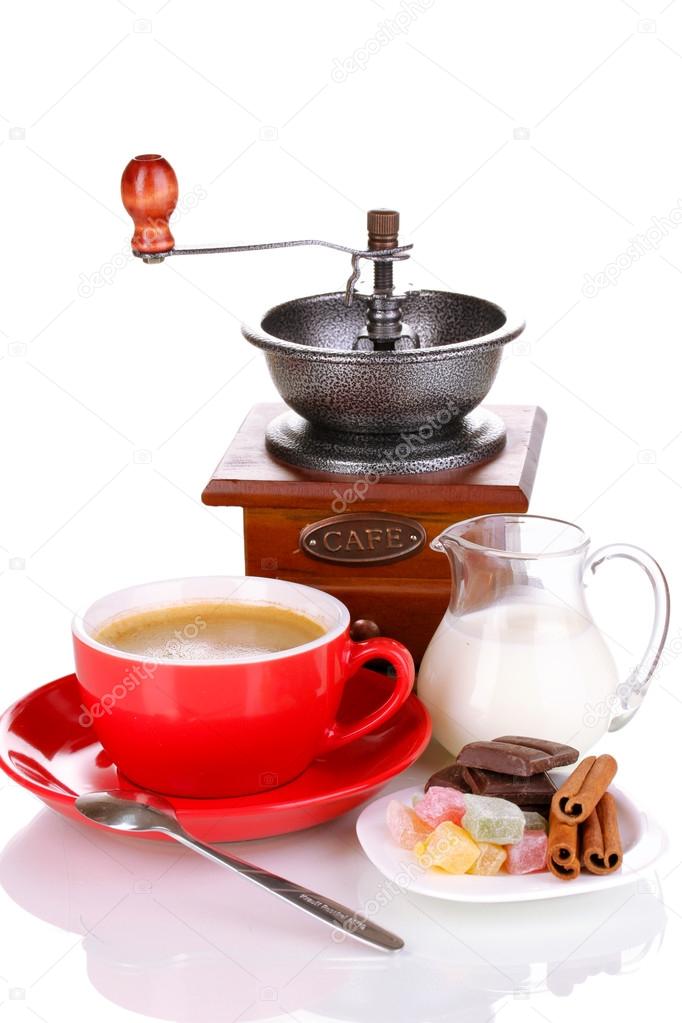 Red cup of coffee with rahat delight and coffee mill isolated on white
