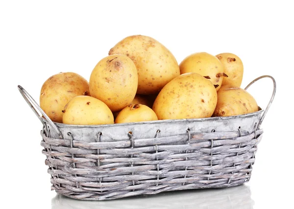 Ripe potatoes on basket isolated on white — Stock Photo, Image