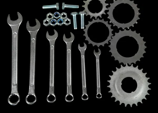 Machine gear, metal cogwheels, nuts and bolts isolated on black — Stock Photo, Image