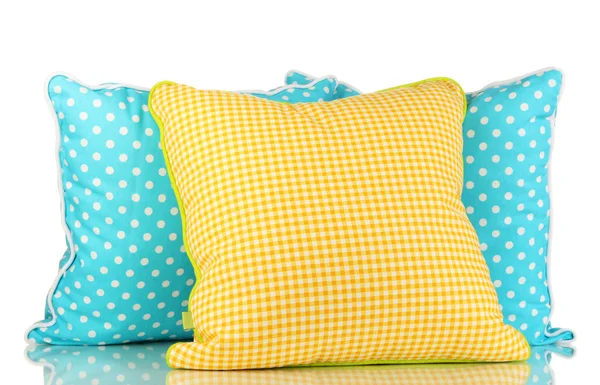 蓝色和黄色的明亮枕头上白色隔离 — 图库照片