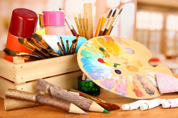 Artistic equipment: paint, brushes and art palette — Stock Photo, Image