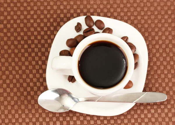 Xícara de café no fundo marrom — Fotografia de Stock
