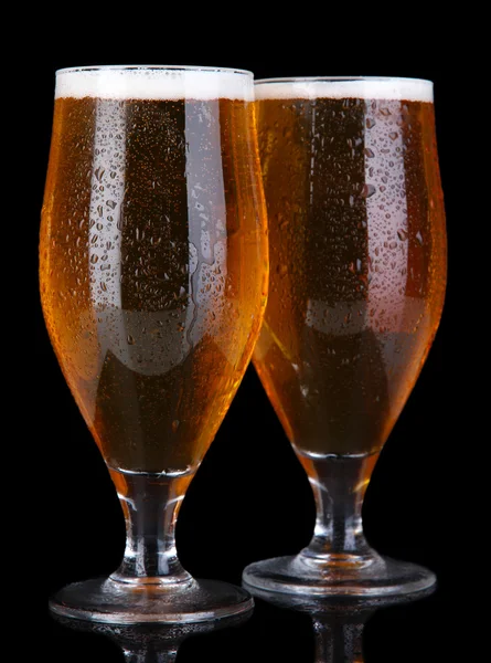 Glasses of beer isolated on black — Stock Photo, Image