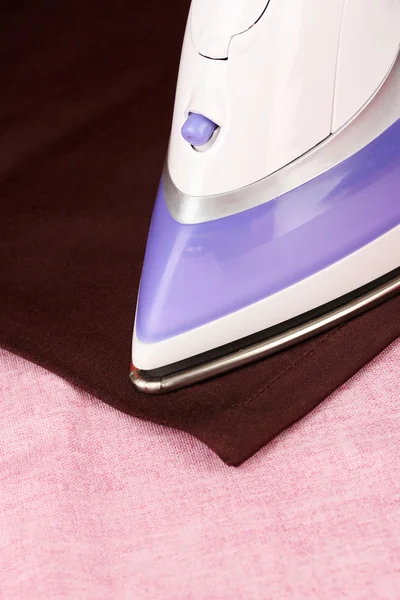 Ironing color textile, close up — Stock Photo, Image