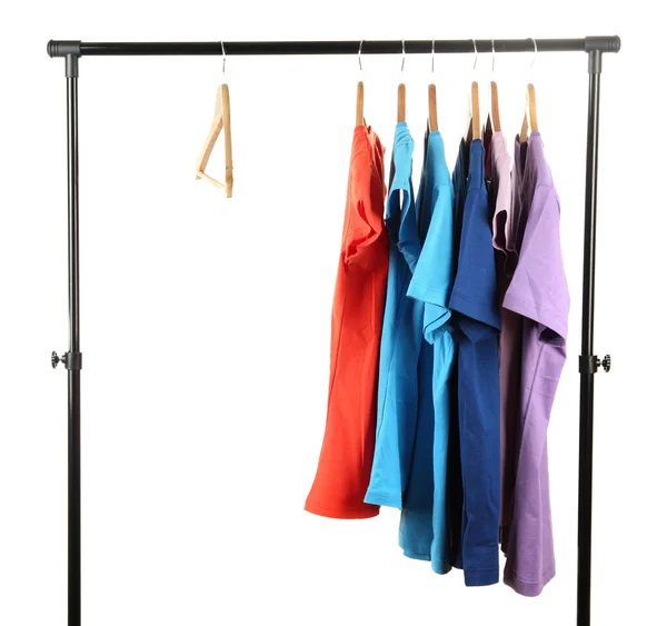 Val av kläder i olika färger på trä galgar, isolerad på vit — Stockfoto