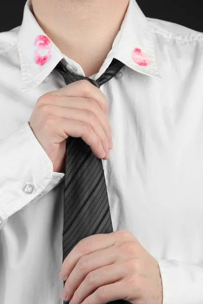 Lipstick kiss on shirt collar of man, isolated on black — Stock Photo, Image