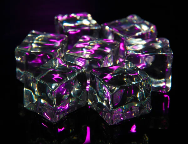 Ice cubes on dark purple background — Stock Photo, Image