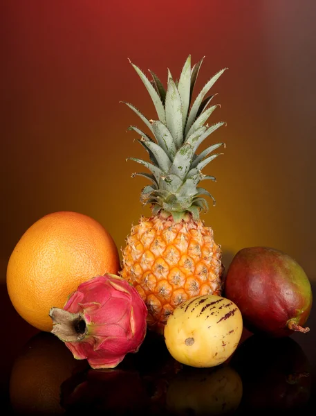 Composition of exotic fruits on colorful background — Stock Photo, Image