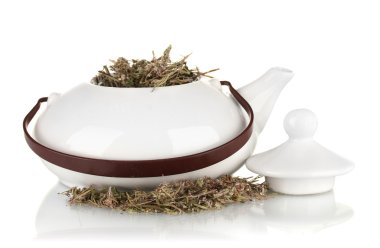 Dried herbs in teapot, isolated on white. Conceptual photo of herbal tea. clipart