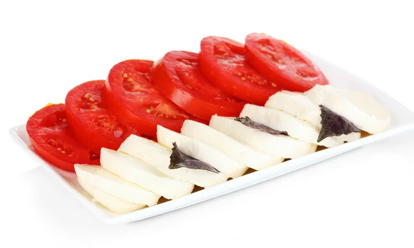 Sabrosa mozzarella con tomates en plato aislado en blanco —  Fotos de Stock