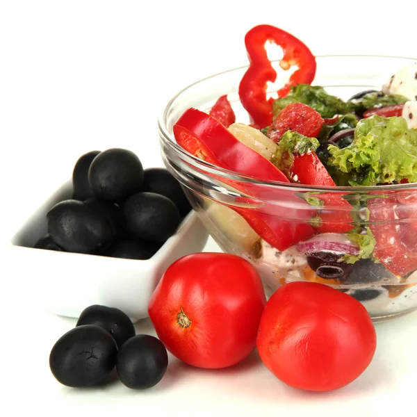 Fresh greek salad in glass bowl isolated on white — Stock Photo, Image