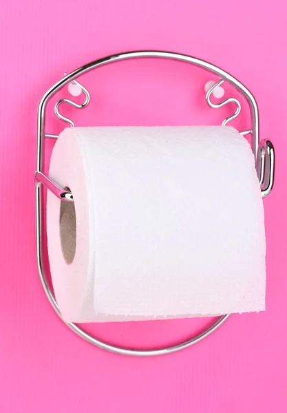 Roll of toilet paper on holder fixed to wall — Stock Photo, Image