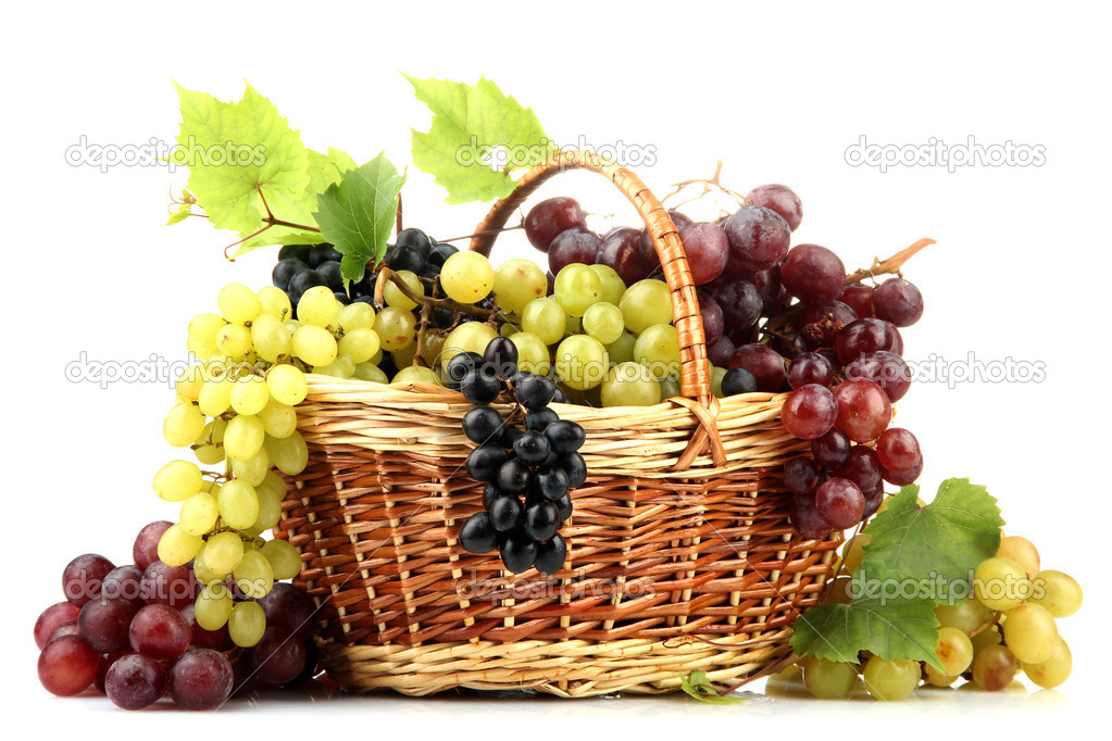 assortment of ripe sweet grapes in basket, isolated on white
