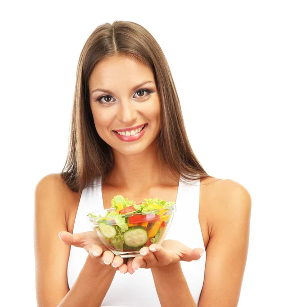 Mooie jonge vrouw met salade, geïsoleerd op wit — Stockfoto
