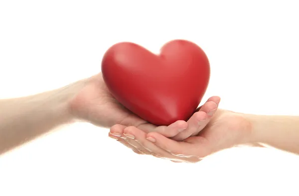 Red heart in woman and man hands, isolated on white — Stock Photo, Image