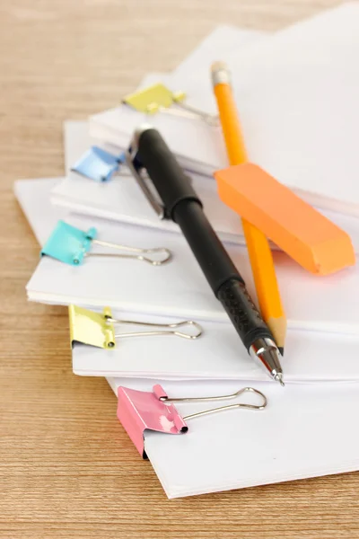 Documents with binder clips on wooden table — Stock Photo, Image
