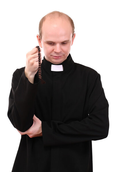 Young pastor with wooden rosary, isolated on white