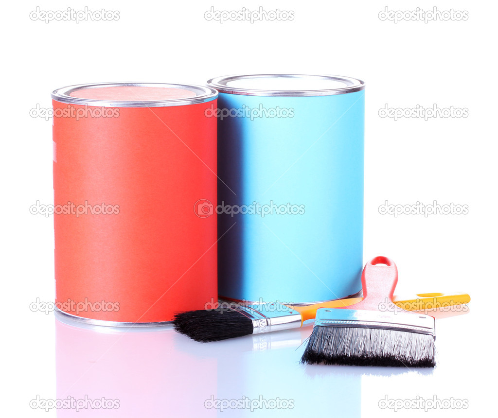 Cans of paint with paintbrushes isolated on white close-up