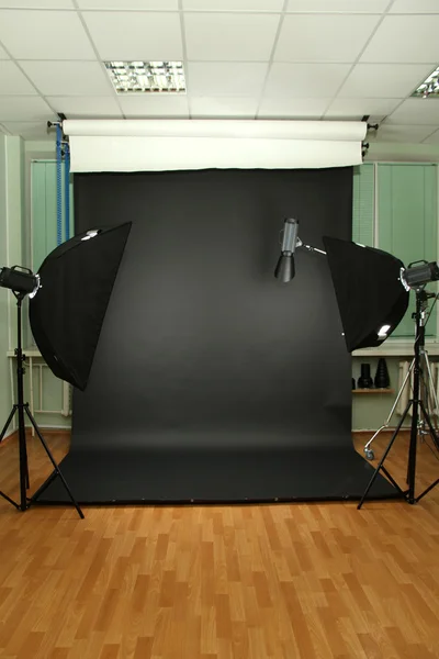 Empty photo studio with lighting equipment — Stock Photo, Image