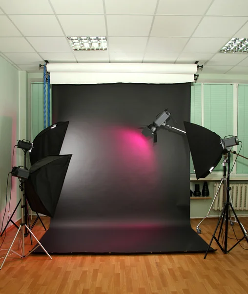 Empty photo studio with lighting equipment — Stock Photo, Image