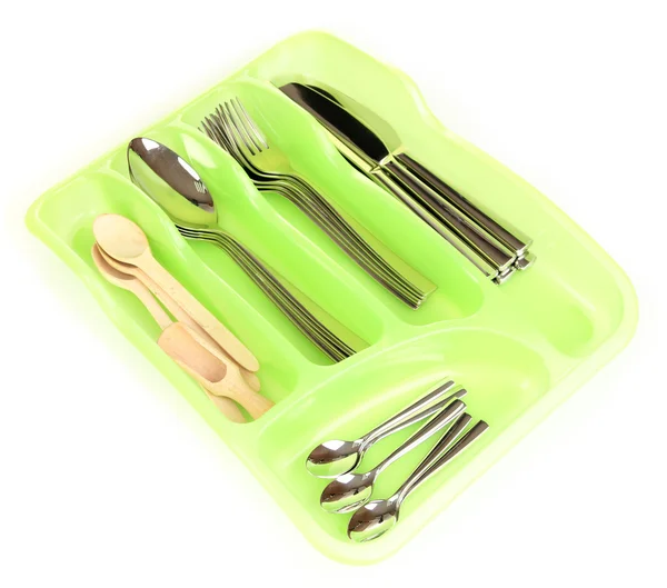 Green plastic cutlery tray with checked silver cutlery and wooden spoons isolated on white — Stock Photo, Image