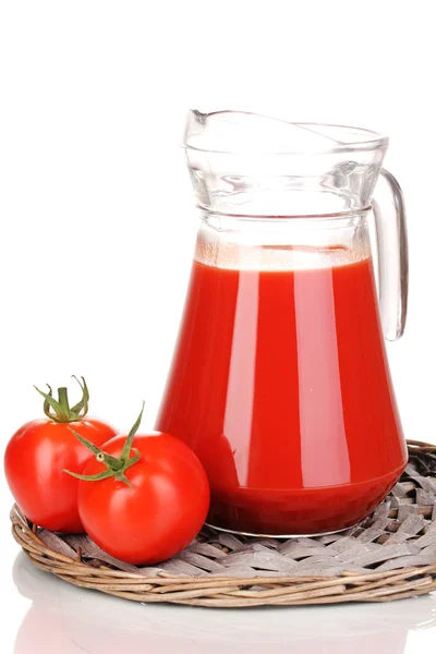 Tomato juice in pitcher on wicker mat isolated on white — Stock Photo, Image