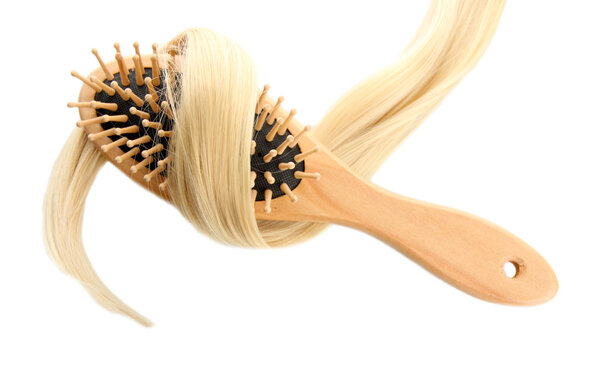 wooden comb brush with hair, isolated on white