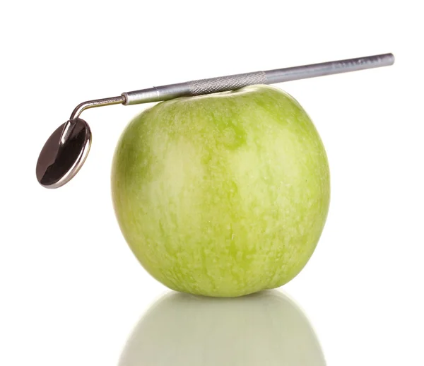 Green apple and dental tool isolated on white — Stock Photo, Image