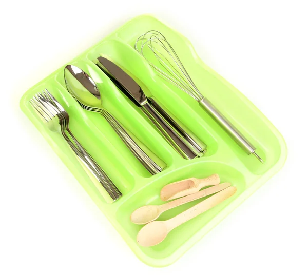 Green plastic cutlery tray with checked silver cutlery and wooden spoons isolated on white — Stock Photo, Image