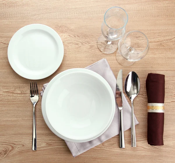 Table setting on wooden table — Stock Photo, Image