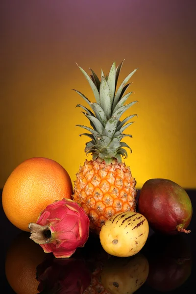 Composition of exotic fruits on colorful background — Stock Photo, Image