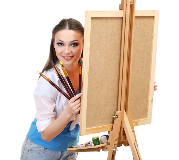 Beautiful young woman painter with brushes, isolated on white — Stock Photo, Image