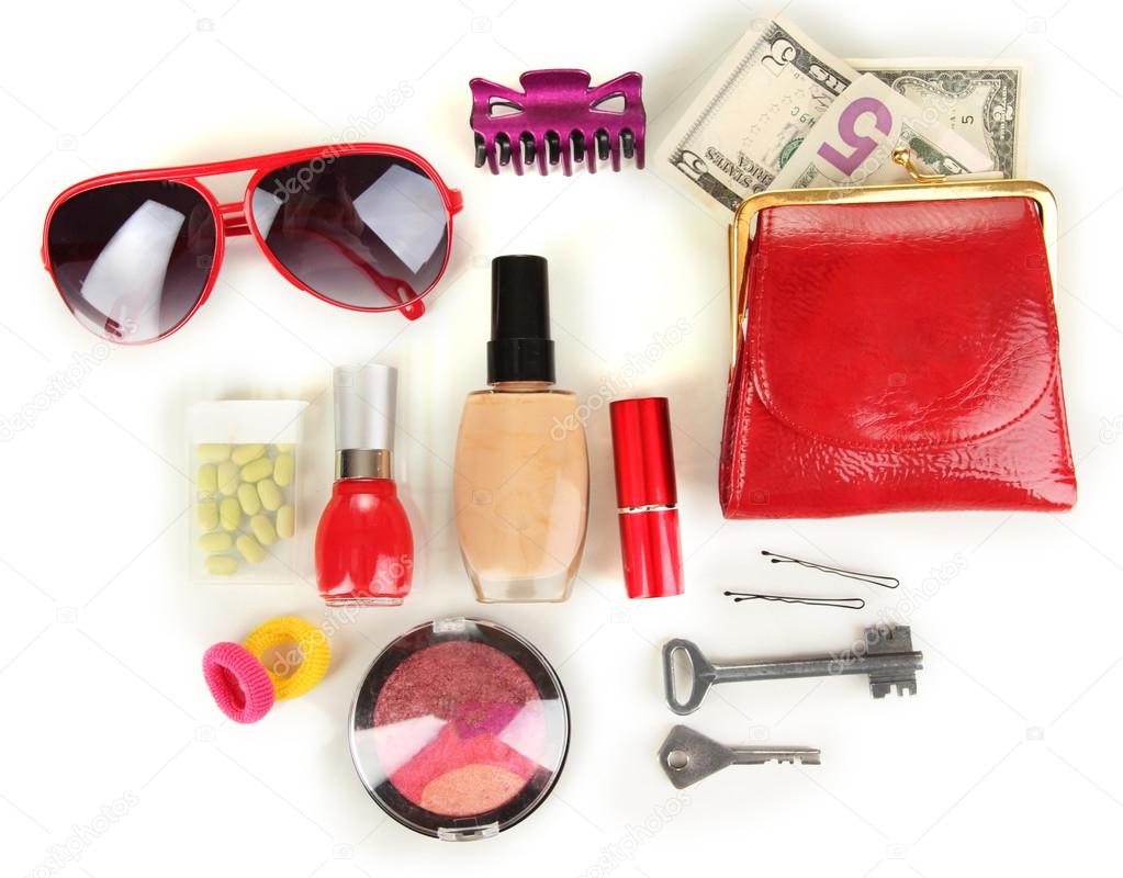 Items contained in the women's handbag isolated on white