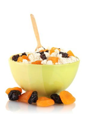 Cottage cheese in color bowl with fruits, isolated on white