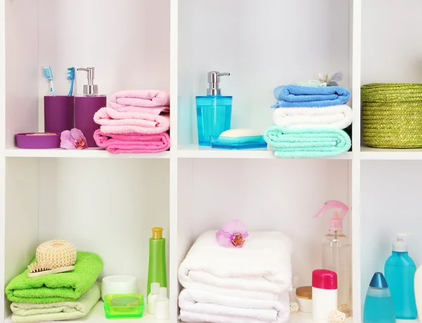 Bath accessories on shelfs in bathroom — Stock Photo, Image