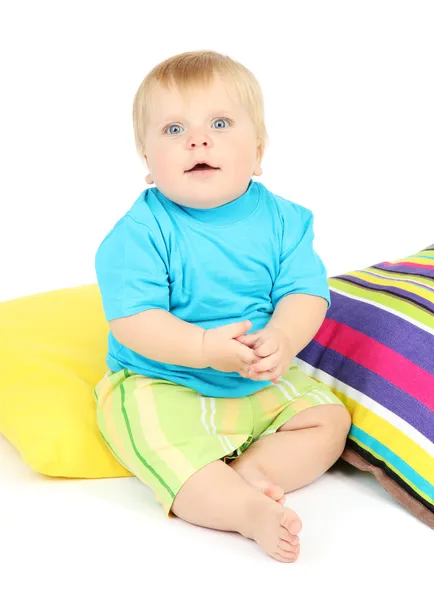 Kleine jongen en kleur kussens, geïsoleerd op wit — Stockfoto