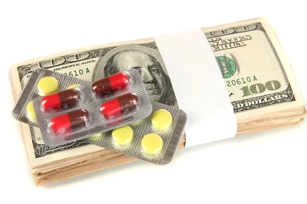 Pills and money isolated on white — Stock Photo, Image