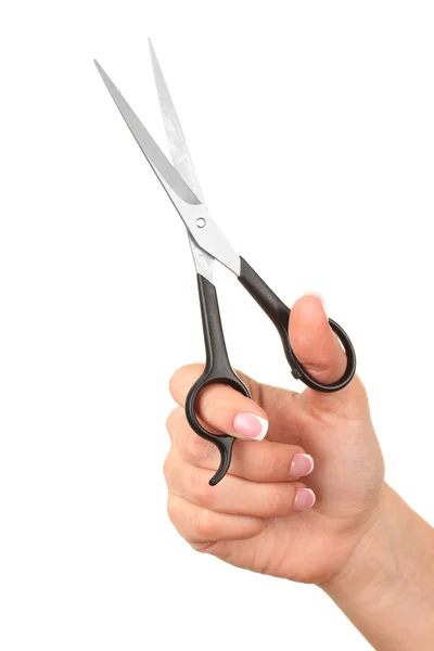 Женская рука с ножницами, изолированными на белом — стоковое фото