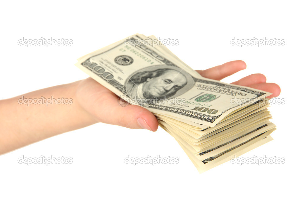 Stack of one hundred dollars banknotes in hand close-up isolated on white