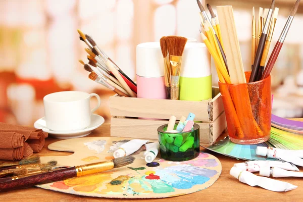 Artistic equipment: paint, brushes and art palette — Stock Photo, Image