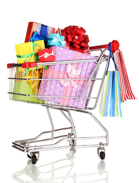 Christmas gifts and shopping in trolley isolated on white — Stock Photo, Image