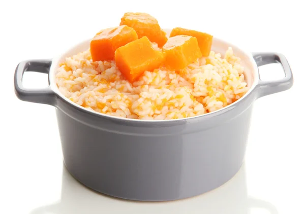 Taste rice porridge with pumpkin in saucepan, isolated on white — Stock Photo, Image