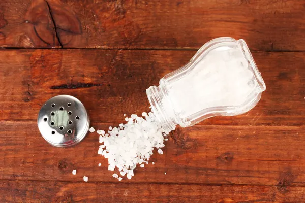 Salt sprinkled on table — Stock Photo, Image