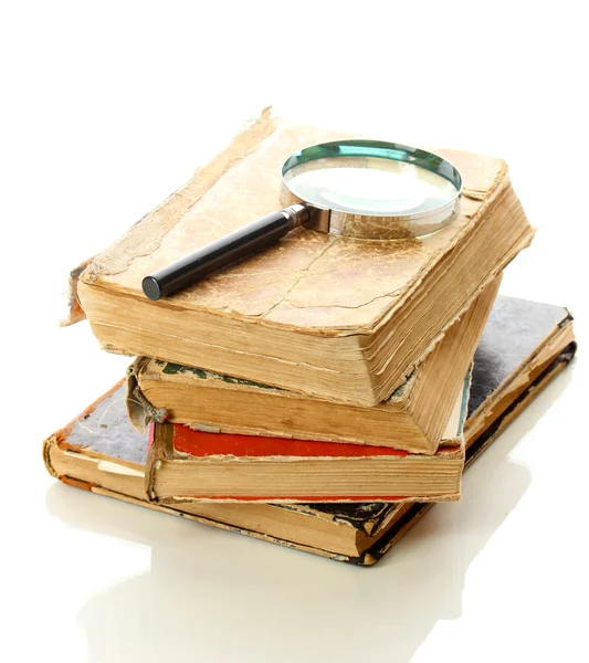 Magnifying glass and books isolated on white — Stock Photo, Image